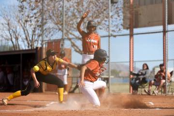 Clark pitcher Noel Gregorich, left, reaches to tag Legacy’s Cassandra Arellano, center, ...