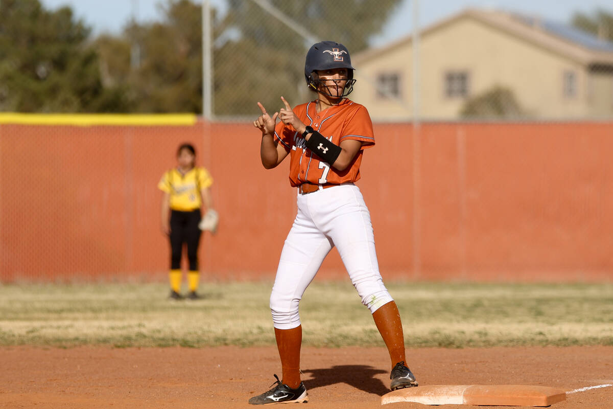 Legacy outfielder Ciara Batalion-Wright (7) dances after hitting a single during a high school ...