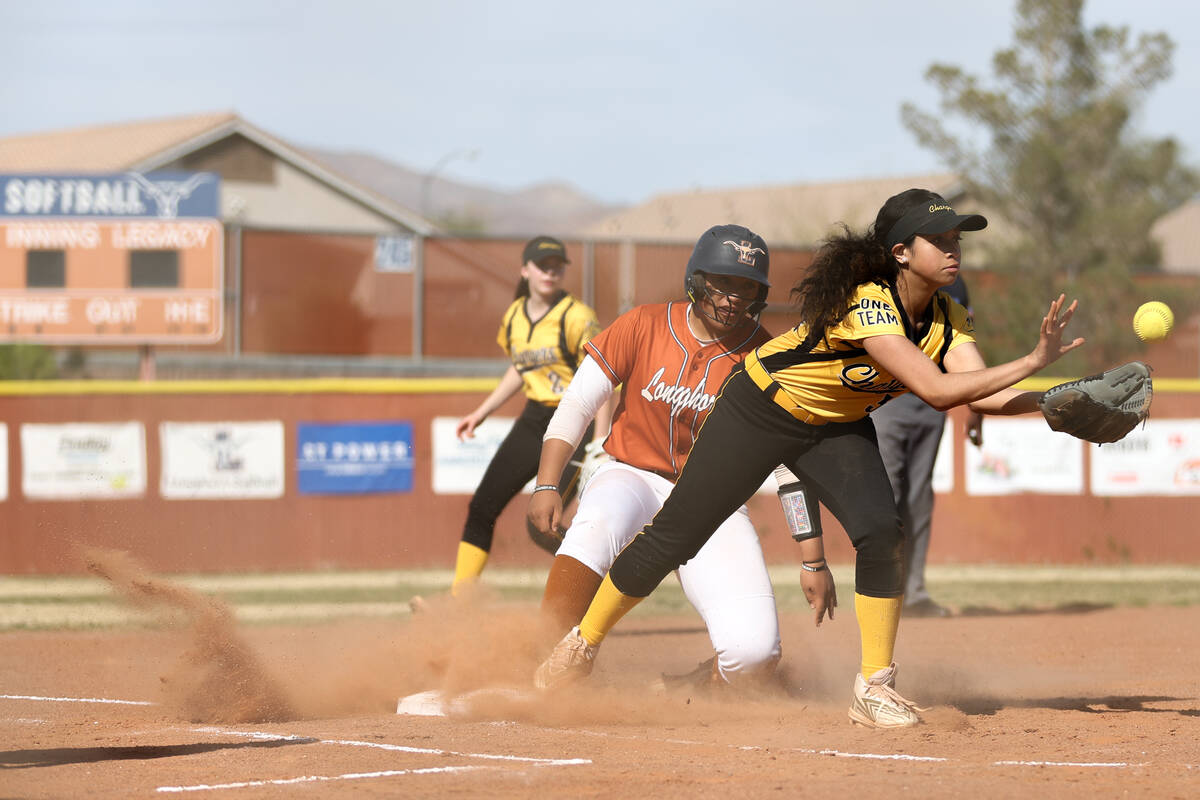 Clark third baseman Ashley Rodriguez (34) while Legacy Aofia Noa (14) slides safely on base dur ...