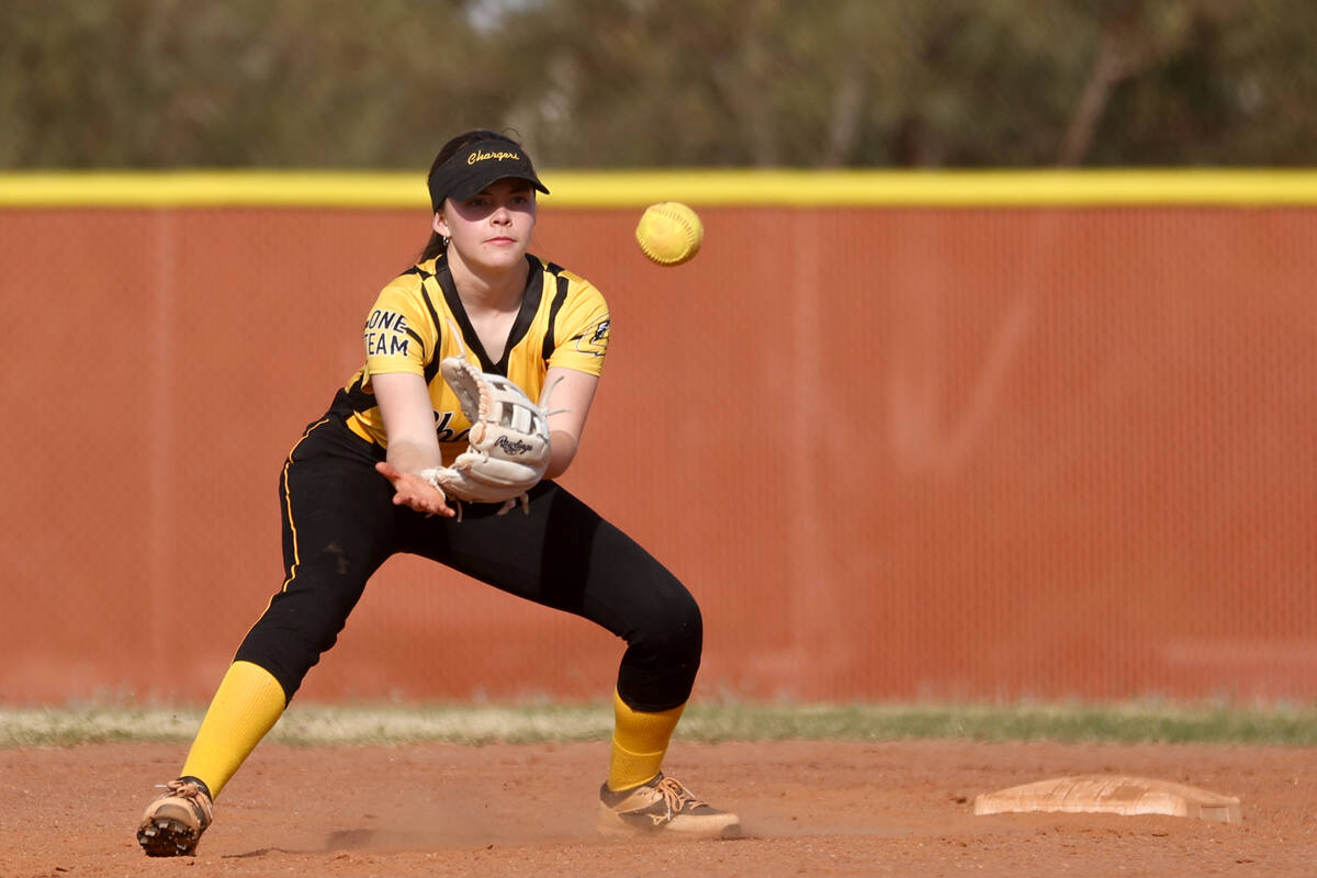 Clark's Lieba Gillet (2) bends to catch during a high school softball game against the Legacy a ...