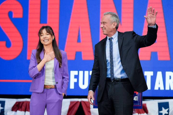 Presidential candidate Robert F. Kennedy Jr. waves on stage with Nicole Shanahan, after announc ...