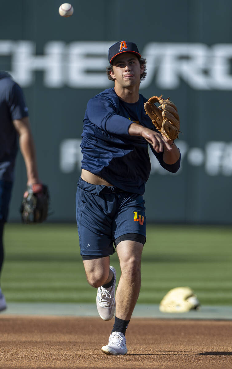 Aviators shortstop Max Muncy throws to first base during practice at the Las Vegas Ballpark on ...