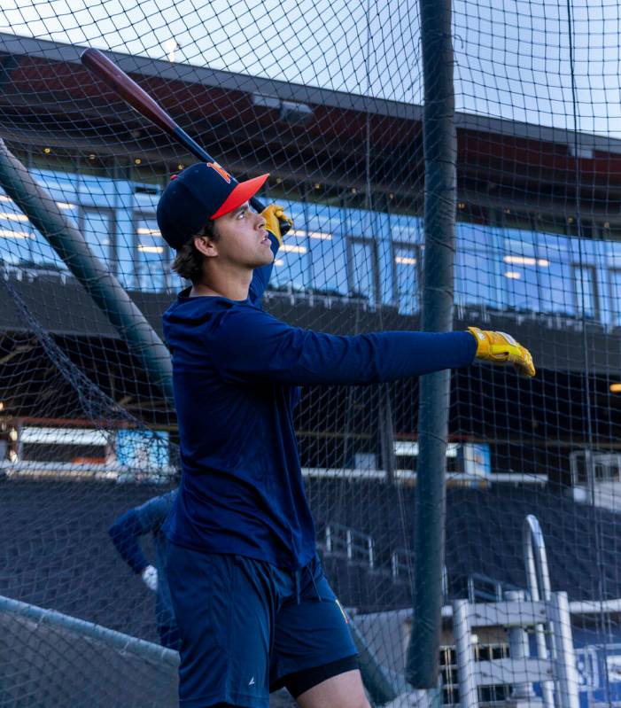 Aviators shortstop Max Muncy watches a ball while batting during practice at the Las Vegas Ball ...