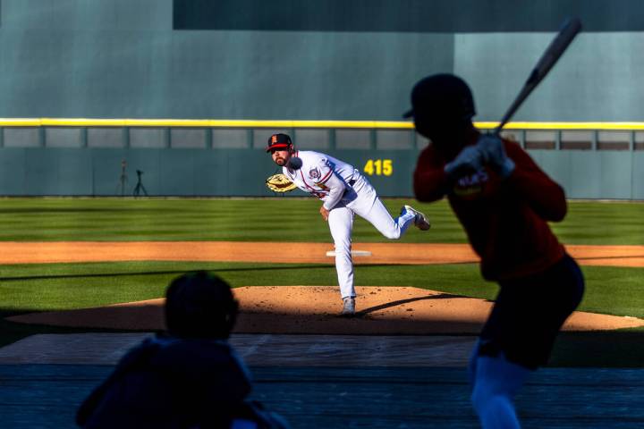 Pitcher Hogan Harris (22) sends a ball towards the plate during practice at the Las Vegas Ballp ...