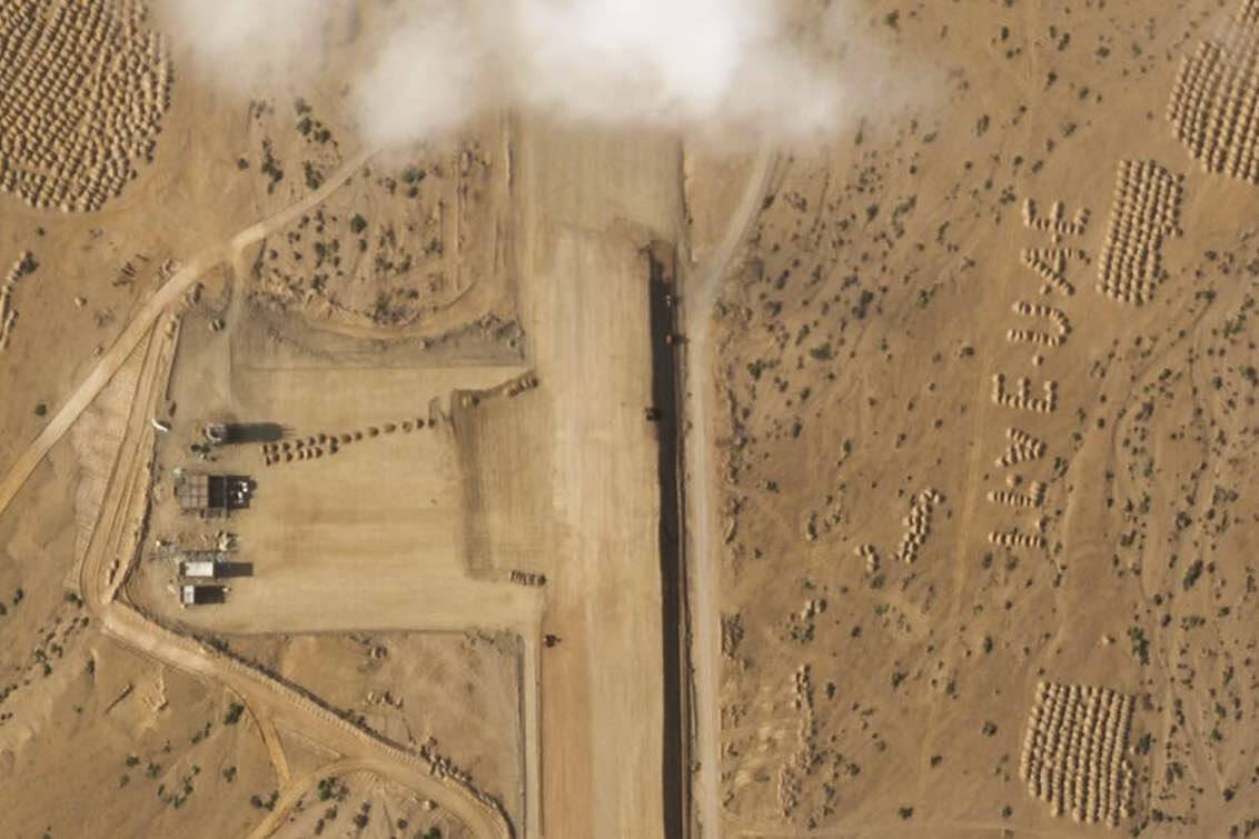 This satellite photo captured by Planet Labs PBC shows the construction of an airstrip on Abd a ...