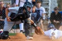 Coronado runner Jackson Thomsen (7) slides safely home beating a tag by Desert Oasis catcher De ...