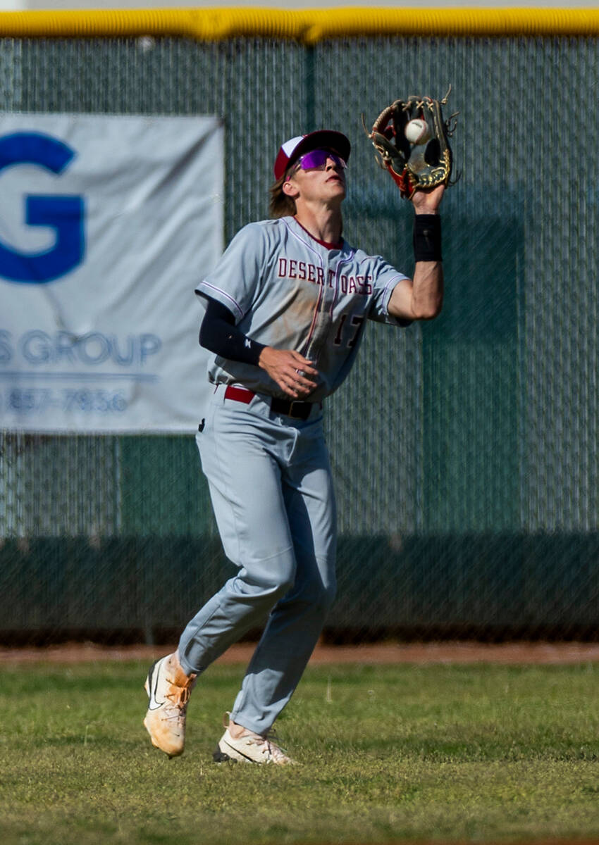 Desert Oasis outfielder Aidan Smith (17) looks in a fly ball against a Coronado batter during t ...