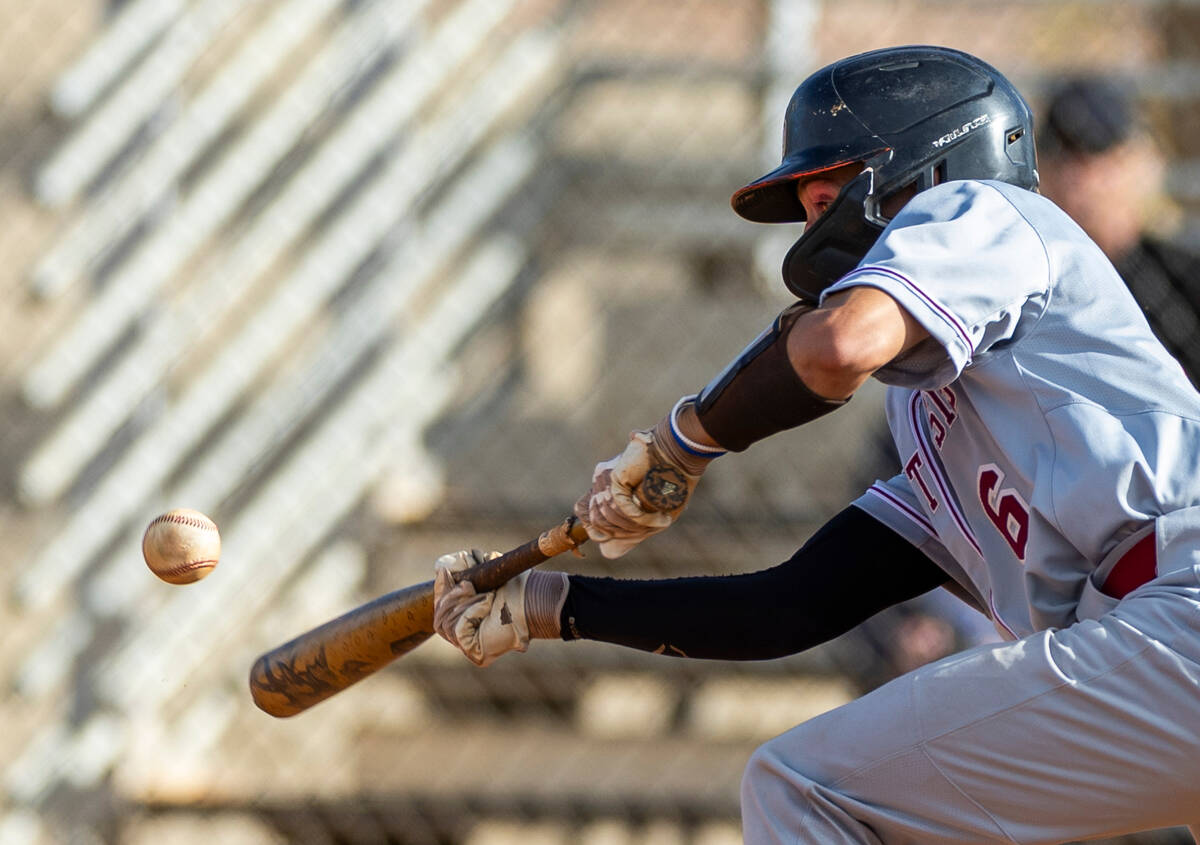 Desert Oasis batter Ryan Martin (6) bunts the ball against Coronado during their NIAA baseball ...