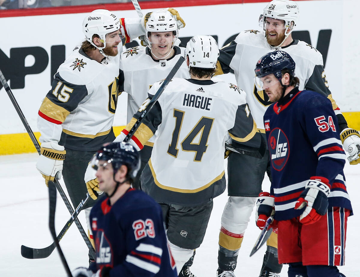 Vegas Golden Knights' Noah Hanifin (15), Pavel Dorofeyev, Nicolas Hague (14) and Anthony Mantha ...