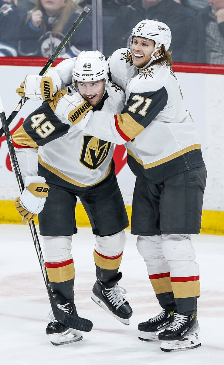 Vegas Golden Knights' Ivan Barbashev (49) and William Karlsson (71) celebrate Barbashev's goal ...