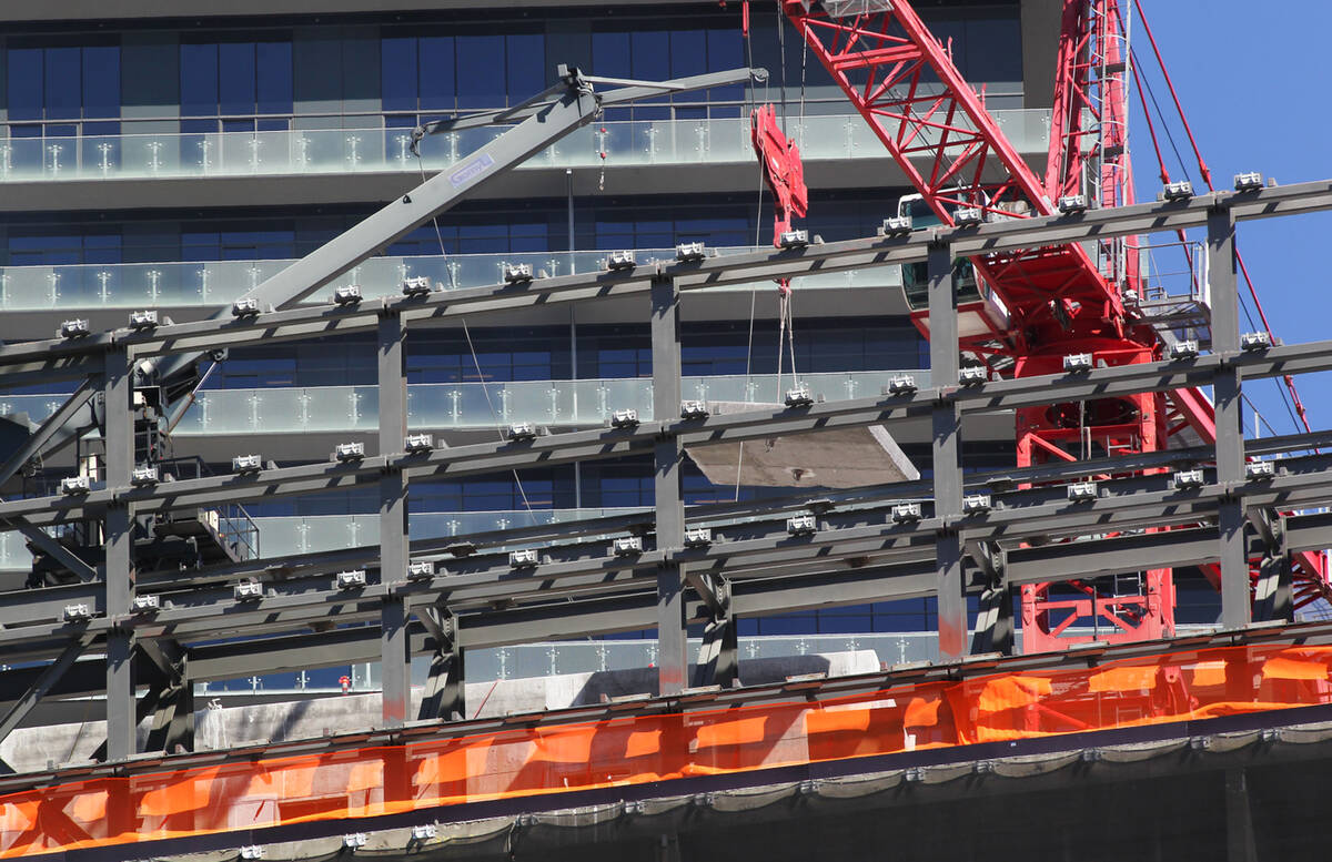 Construction crews work on demolishing the unfinished Harmon Hotel at CityCenter in Las Vegas o ...