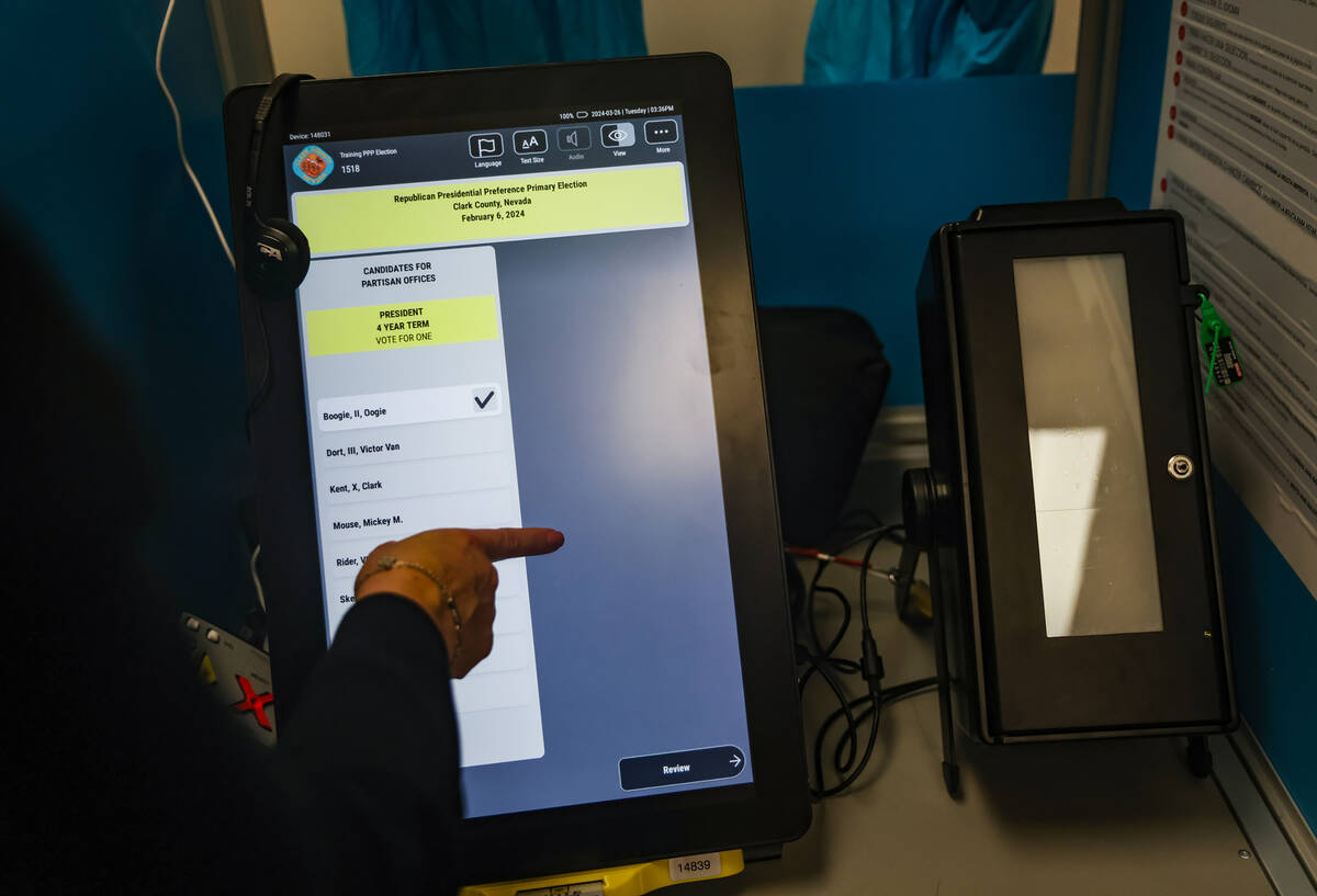 Clark County Registrar Lorena Portillo shows the Review-Journal how a voting machine works at t ...