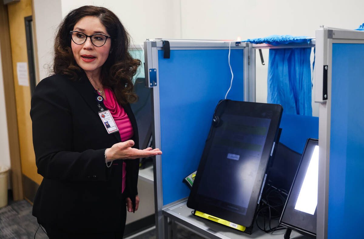 Clark County Registrar Lorena Portillo shows the Review-Journal how a voting machine works at t ...