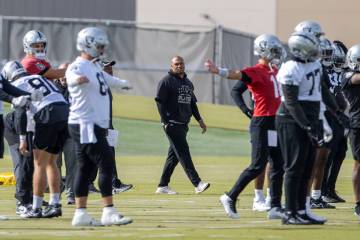 Raiders interim head coach Antonio Pierce walks through practice at the Intermountain Health Pe ...