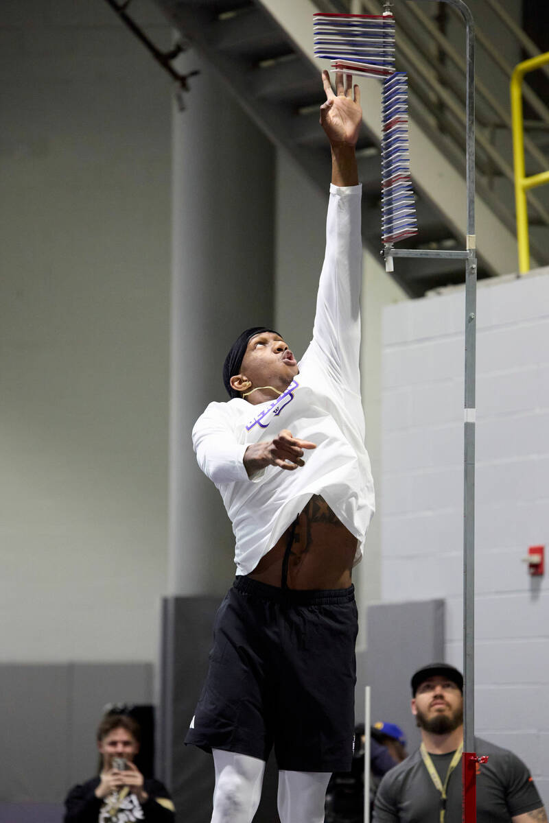 Washington quarterback Michael Penix Jr. does a vertical jump during the team's NFL football pr ...