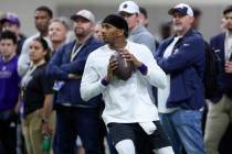 Washington quarterback Michael Penix Jr. looks to throw during the team's NFL football pro day ...