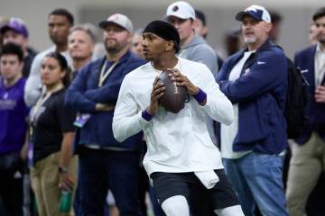Washington quarterback Michael Penix Jr. looks to throw during the team's NFL football pro day ...