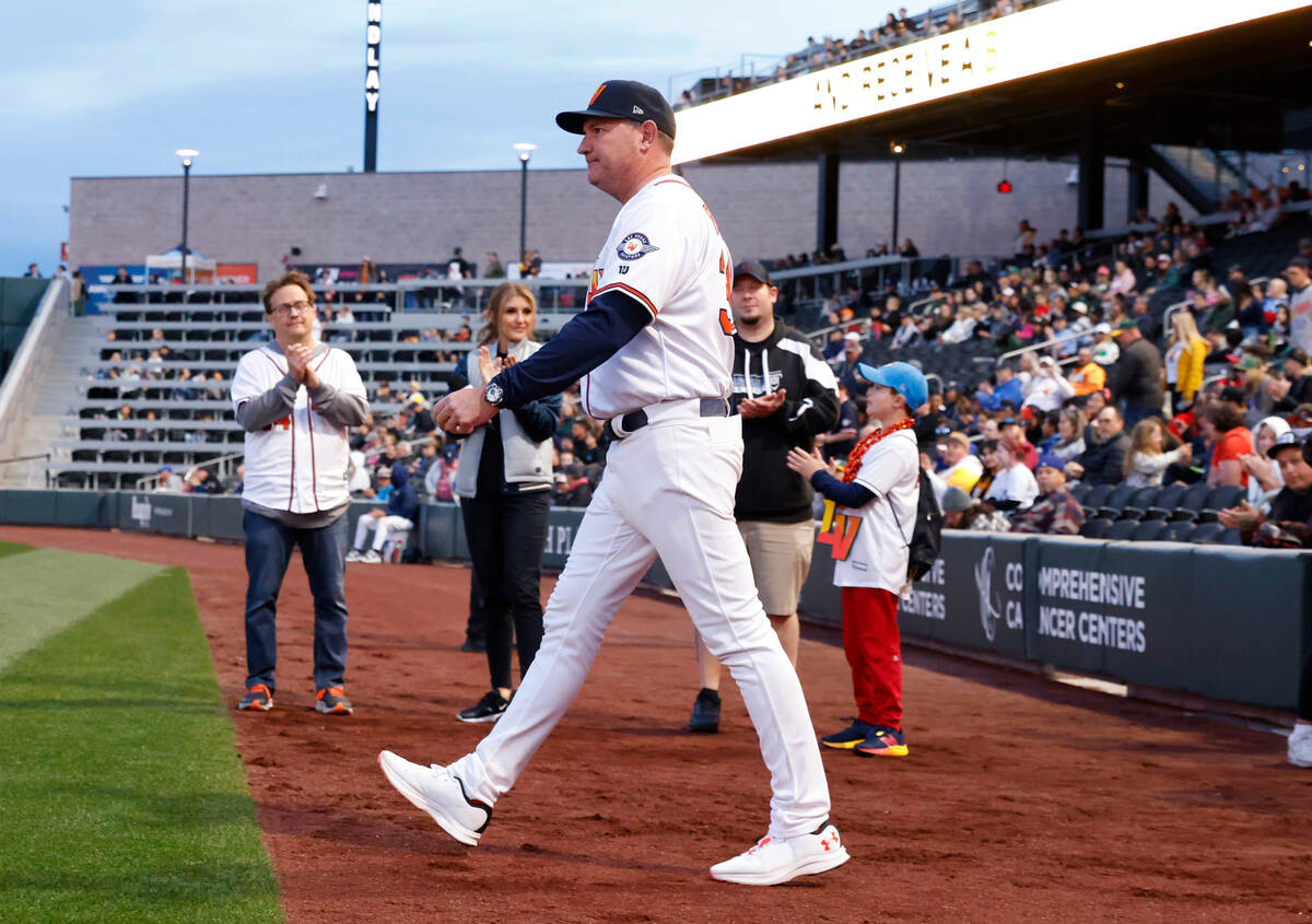 Aviators Manager Fran Riordan takes the field before the start of the home opener against the R ...