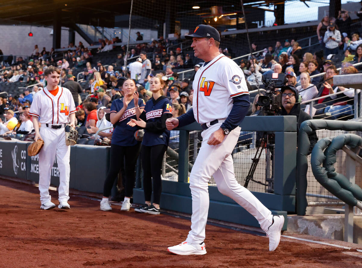 Aviators Manager Fran Riordan takes the field before the start of the home opener against the R ...