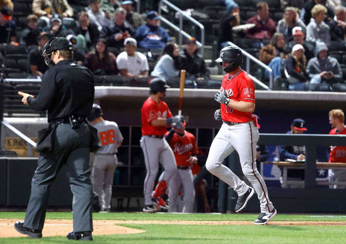 Reno Aces outfielder Kyle Garlick (17) runs bases after hitting a solo homer against Las Vegas ...