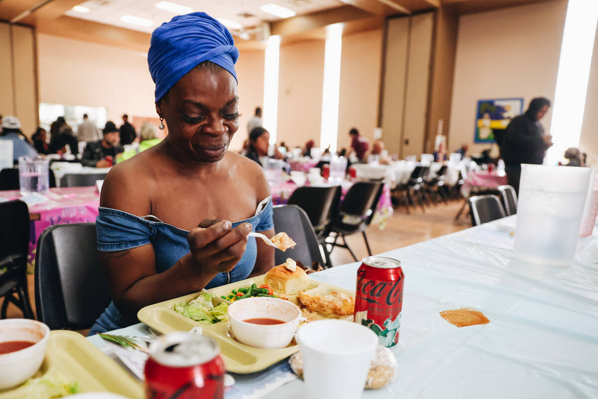 Christy Love eats an annual Easter meal served at the Las Vegas Rescue Mission on Friday, March ...