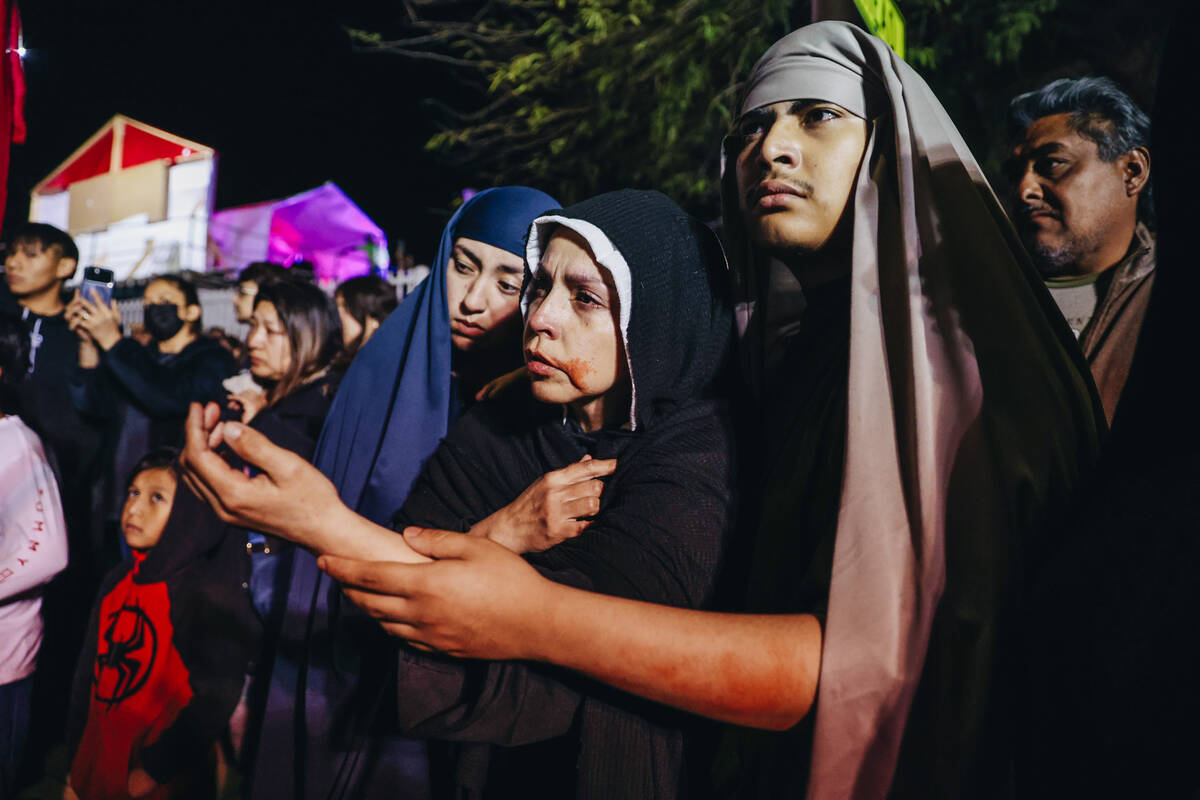 The Stations of the Cross are acted out during a live performance for Good Friday at St. Bridge ...