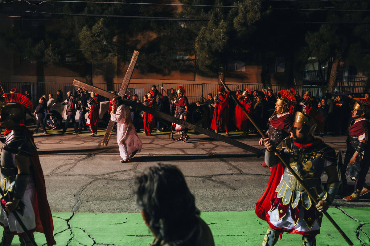 The Stations of the Cross are acted out during a live performance for Good Friday at St. Bridge ...
