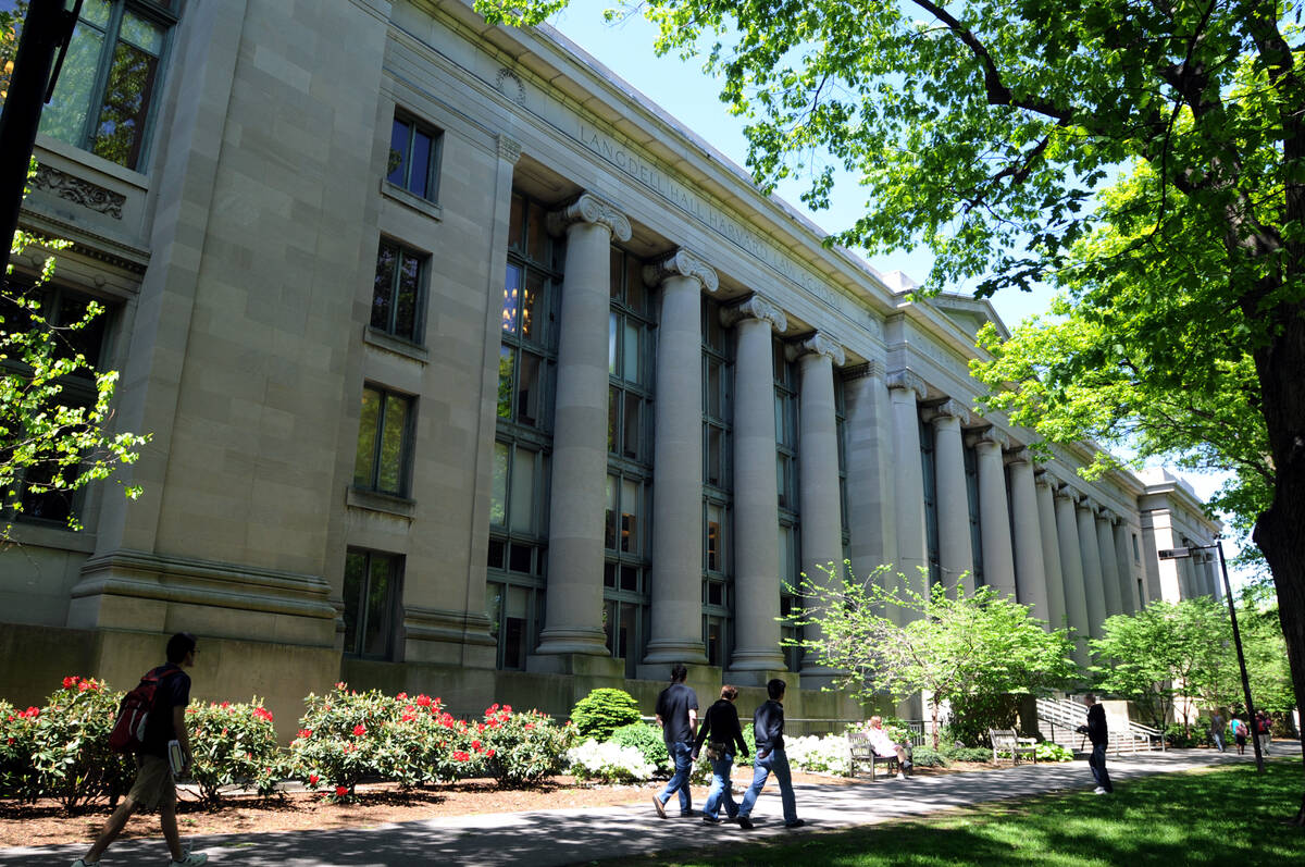 People walk outside Harvard Law School's Langdell Hall on May 10, 2010, at Harvard University i ...