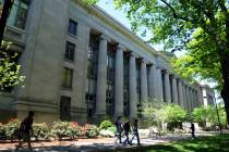 People walk outside Harvard Law School's Langdell Hall on May 10, 2010, at Harvard University i ...