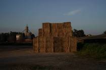 Bales of hay are stacked in Kibbutz Nahal Oz, Israel, Wednesday, Feb. 28, 2024. (AP Photo/Leo C ...