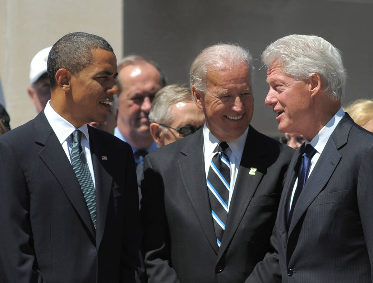 Left to right, then President Barack Obama, Vice President Joe Biden, and former president Bill ...