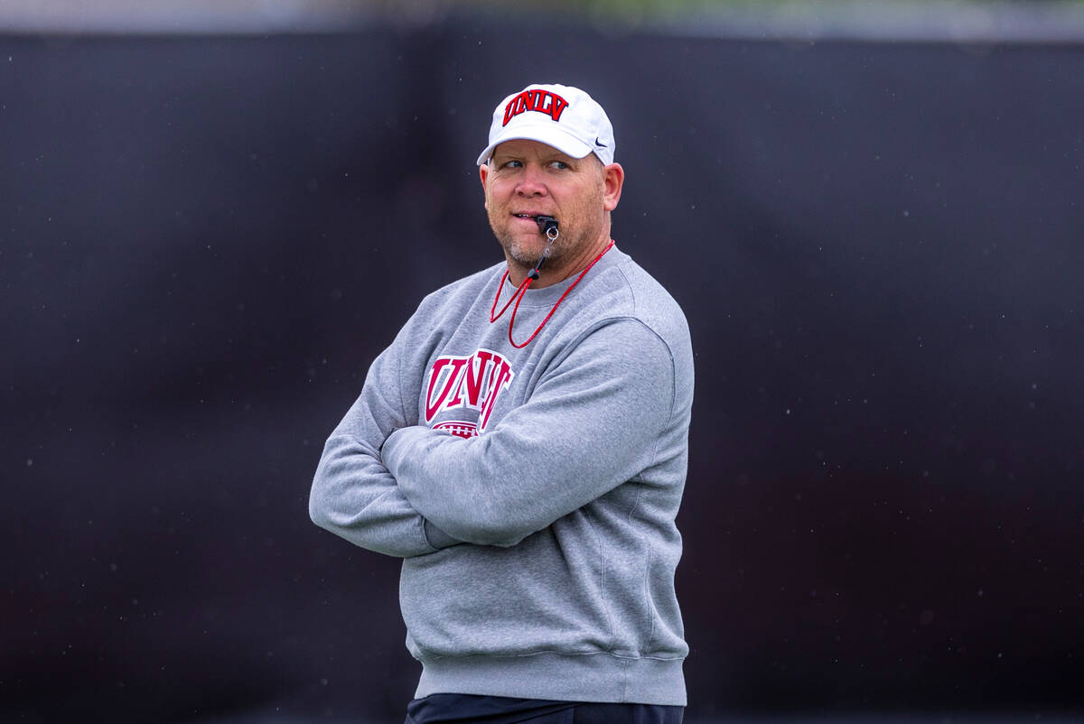 UNLV head coach Barry Odom observes his players during spring football practice at the Fertitta ...