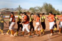 Legacy high fives Clark after winning a high school softball game at Legacy High School on Wedn ...