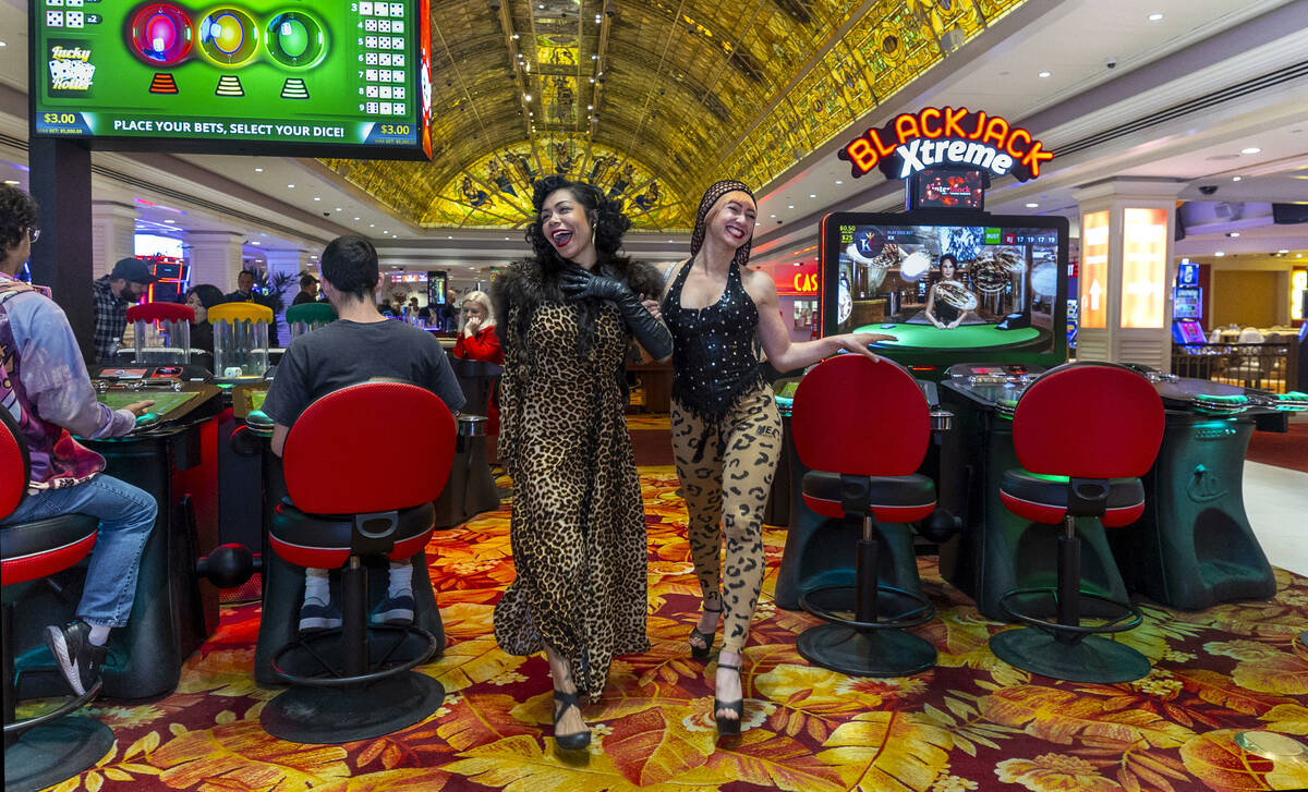 Heather Holliday, left, and Liinda Garisto take a stroll about the remaining active electronic ...