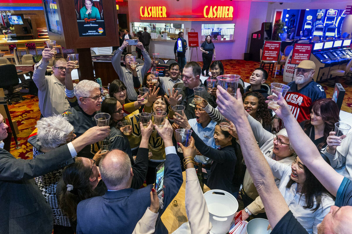 Now shut down the table games staff and others gather for a champagne toast during the final ni ...