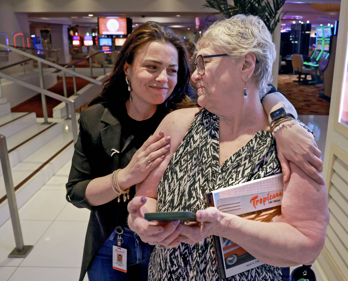 Hotel Manager Cynthia Suhyoun, left, hugs Lynn Bradley, who has worked as lead operator for 11 ...