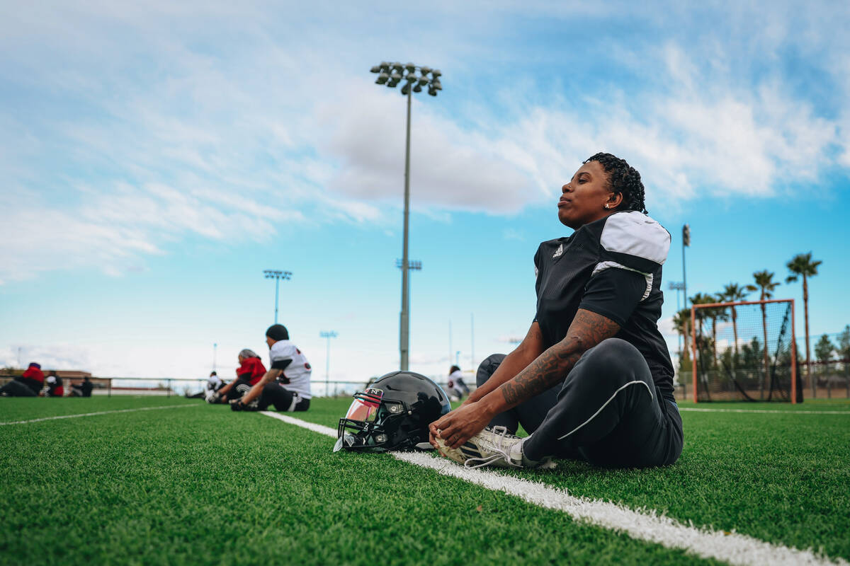 The Las Vegas Silver Stars, a women’s professional football team, warm up at the start o ...