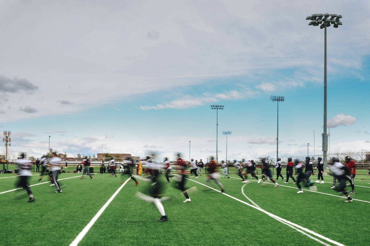 The Las Vegas Silver Stars, a women’s professional football team, practice drills at Fai ...