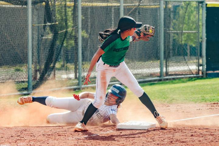 Shadow Ridge High School’s Giselle Castellanos (9) skids safe to third past Palo Verde H ...