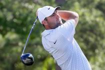 Scottie Scheffler tees off on the first hole during the first round of the Houston Open golf to ...