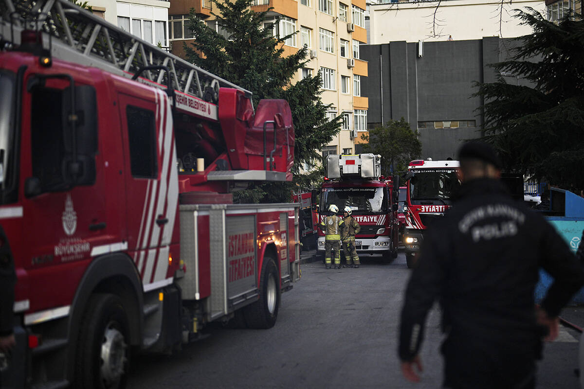 Firefighters work after a fire broke out in a nightclub in Istanbul, Turkey, Tuesday, April 2, ...