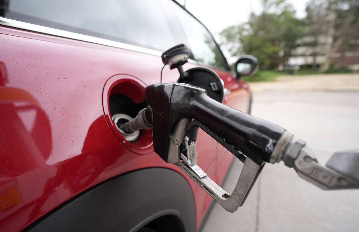 A motorist fills up the tank of a vehicle at a Shell station Wednesday, July 5, 2023, in this A ...