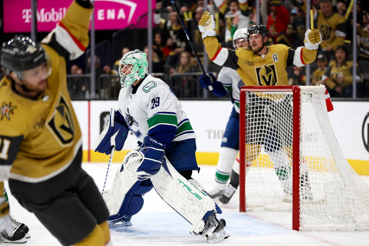 Golden Knights right wing Jonathan Marchessault, left, and center Jack Eichel (9) celebrate a s ...