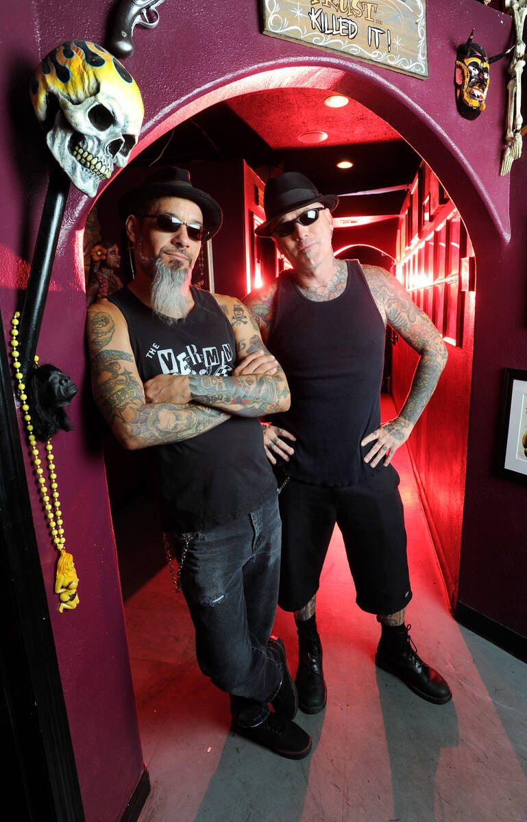 Rob Ruckus, left and Dirk Vermin are shown at the Pussykat Tattoo shop in Las Vegas on Aug. 2, ...