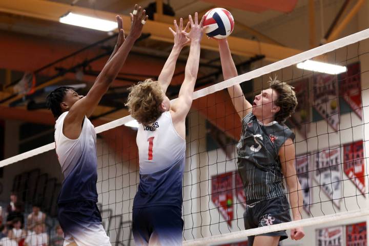 Arbor View outside hitter Mark Blanchard (5) hits against Coronado middle blocker Jayden Bell, ...