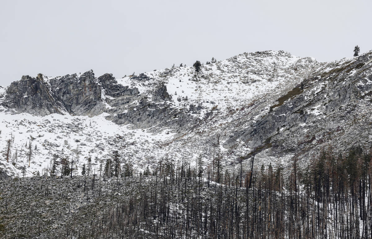 The snow level on a mountain peak is seen near Phillips Station, Calif., Tuesday, Jan. 2, 2024. ...