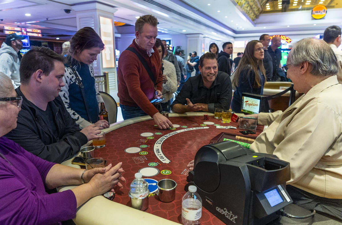 The last hand of blackjack is played and chips collected during the final night of gaming at th ...