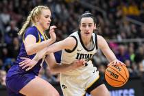 Iowa guard Caitlin Clark (22) is defended by LSU guard Hailey Van Lith (11) during the second h ...