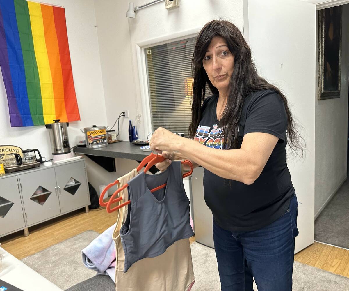 Jamie Lee Sprague, the founder of the nonprofit Las Vegas TransPride organization, displays che ...