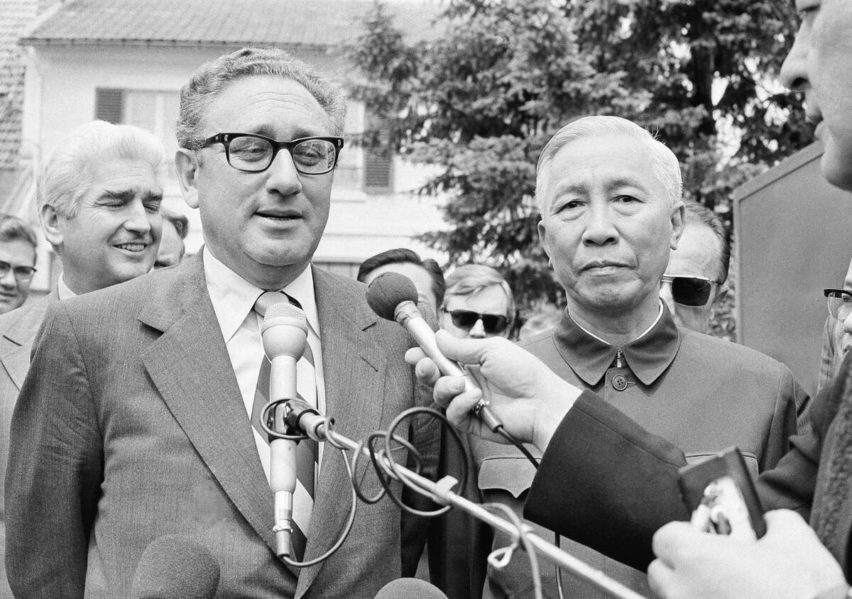 FILE - Henry Kissinger, left, President Richard Nixon's national security adviser, and Le Duc T ...